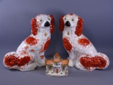 RED & WHITE STAFFORDSHIRE SEATED SPANIELS, a pair, 31cms H and a pottery pastille burner