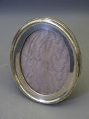 SILVER EASEL PICTURE FRAME, oval, Birmingham 1912, 16 x 11cms picture size