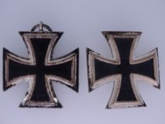 TWO WORLD WAR II GERMAN THIRD REICH IRON CROSSES including a First Class three part with magnetic