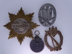 WORLD WAR II GERMAN MEDALS & BADGES, four items including an Infantry Assault badge lacking pin, a
