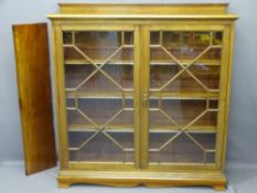 MAHOGANY ASTRAGAL GLAZED BOOKCASE with back rail top over thirteen pane twin-glazed doors and