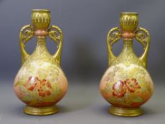 LIMOGES - a pair of floral decorated twin-handled narrow neck vases, 26cms H