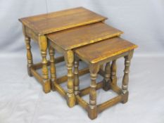 GOOD REPRODUCTION OAK NEST OF THREE TABLES, 47cms H, 55cms W, 35cms D the largest