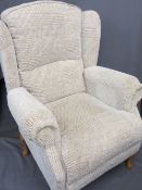 A MODERN WINGBACK ARMCHAIR, beige in colour
