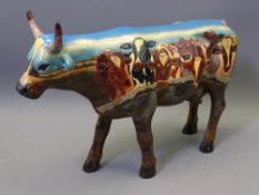 LARGE COW PARADE POTTERY FIGURINE decorated with cows looking over a wall, 20cms max H, 30cms L