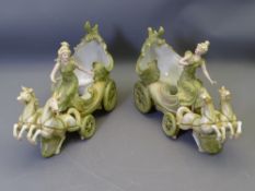 PAIR OF CONTINENTAL FLOWER HOLDERS, style of Royal Dux, each in the form of a four wheeled chariot