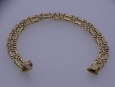 A 9CT GOLD DOUBLE PANTHER LINK FANCY BRACELET, 18.7grms