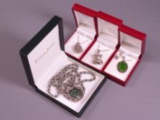 FOUR VINTAGE NECKLACES in presentation boxes to include a heart form pendant with cased green