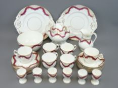 VICTORIAN PART BREAKFAST SET, 29 pieces in pink and gold comprising 2 sandwich plates, 6 cups,