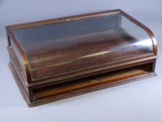 CIRCA 1910 MAHOGANY COUNTER TOP DISPLAY CABINET with curved glass lidded top, an open under-
