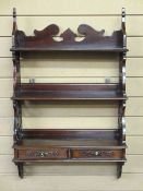 REPRODUCTION MAHOGANY WALL HANGING SHELF with fretwork sides and twin lower front drawers, 86cms
