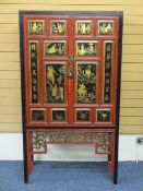 VINTAGE STYLE TWO DOOR CHINESE LACQUER WORK CABINET having twin multi-raised panel doors with gilt