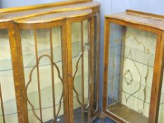 TWO VINTAGE CHINA DISPLAY CABINETS including a 1920s walnut example with shaped front doors,