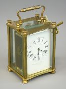 FRENCH BRASS CASED CARRIAGE CLOCK retailed by Finnegans Ltd, Manchester and Liverpool, bevelled edge