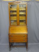 ART DECO OAK BUREAU BOOKCASE with leaded glass doors to the upper section on an unusual bureau base,