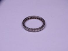 DIAMOND SET FULL ETERNITY RING, unmarked and untested white metal believed gold, set with 23 x 0.