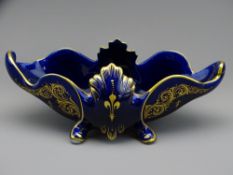 FRANCOIS I CRESTED FOUR FOOTED BOWL, cobalt ground with hand painted gilt decoration on four feet,