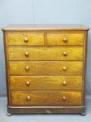VICTORIAN MAHOGANY CHEST of two short over four long drawers, all having turned wooden knobs, 129cms