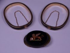 MICRO MOSAIC CLASP and two gilt metal and black enamel bangles, the mosaic of a mythical winged lion