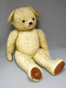 LARGE MOHAIR TEDDY BEAR with jointed limbs and rexine pads (play worn condition), 106cms L