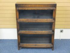 VINTAGE OAK THREE SECTION BOOKCASE, Globe Wernicke style with lift-up glass front doors, 112cms H,