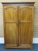 CIRCA 1910 MAHOGANY TWO DOOR WARDROBE with Venetian type arch carving to the cornice over two twin