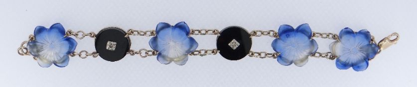 9CT GOLD BLACK ONYX DIAMOND & HARDSTONE BRACELET, the hardstone carved as four flower heads