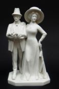 GERMAN WHITE GLAZED PORCELAIN FIGURAL GROUP OF AN EDWARDIAN LADY & GENTLEMAN standing in formal