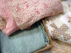 THREE VINTAGE FLORAL PRINTED QUILTS