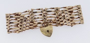 9CT GOLD SEVEN BAR GATE BRACELET, 16.1gms