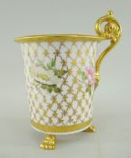SWANSEA PORCELAIN CABINET CUP of cylindrical shape with everted rim and raised on three paw feet,