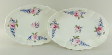PAIR OF NANTGARW PORCELAIN OVAL CRUCIFORM DISHES both painted with groups of blue flowers and pink