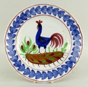A LLANELLY COCKEREL PLATE typically decorated with sponged leaves to the border, believed to have