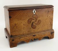 WELSH JOINED OAK MINIATURE COFFER having a stepped base with carved apron and bracket feet,