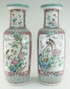 PAIR CHINESE FAMILLE ROSE PORCELAIN ROULEAU VASES, 19th Century, well painted with large opposing