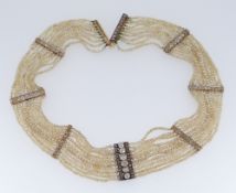 DIAMOND & SEED PEARL CHOKER NECKLACE having eight diamond encrusted bars, 38.5cms long Condition