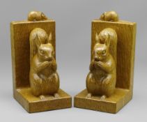 ROBERT 'MOUSEMAN' THOMPSON OF KILBURN: A PAIR OF CARVED OAK SQUIRREL BOOKENDS, each modelled with
