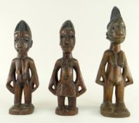 PAIR OF YORUBA MALE & FEMALE IBEJIS, Nigeria, 24cms and another, 30cms (3)