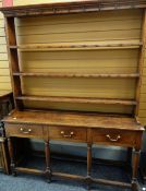 EARLY 19TH CENTURY WELSH OAK HIGH DRESSER with open three-shelf delft rack above base fitted three