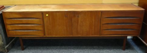 MID-CENTURY TEAK SIDEBOARD central cupboard between sets of drawers, 221 x 45.5 x 73cms