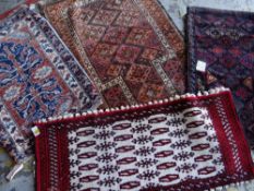 ASSORTED TRIBAL ENTRANCE OR SAMPLER RUGS including a Mashad narrow tent or pillow bag (4)