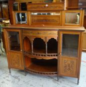 EDWARDIAN WALNUT MIRROR BACK SIDEBOARD, floral carved tops and central bow front with spindles and