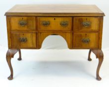 QUEEN ANNE-STYLE WALNUT DESK, fitted five drawers around an arched kneehole, carved cabriole legs,
