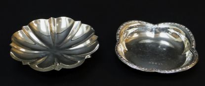 TWO MODERN SILVER BON BON DISHES, one of lobed square design, the other circular flower head,