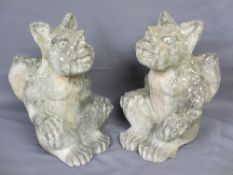 RECONSTITUTED STONE WINGED SEATED GARGOYLES, a pair, 44cms H, 28cms W