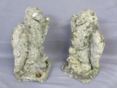RECONSTITUTED STONE GARDEN ORNAMENTS, a pair, modelled as eagles standing on a duck's back