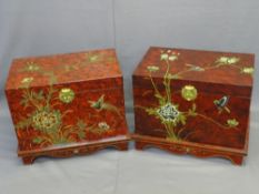 TWO JAPANESE SIMULATED RED LACQUER WORK CHESTS, a pair, lift-up lids with brass clasps and lined