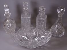 GLASSWARE to include heavy oval bowl and four decanters with stoppers