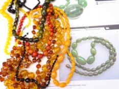 COLLECTION OF CHERRY AMBER & GREEN AMBER BAKELITE STYLE BEADS and other assorted beads