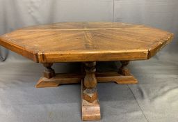 REPRODUCTION ANTIQUE PINE STYLE COFFEE TABLE, octagonal segmented type top on turned supports with